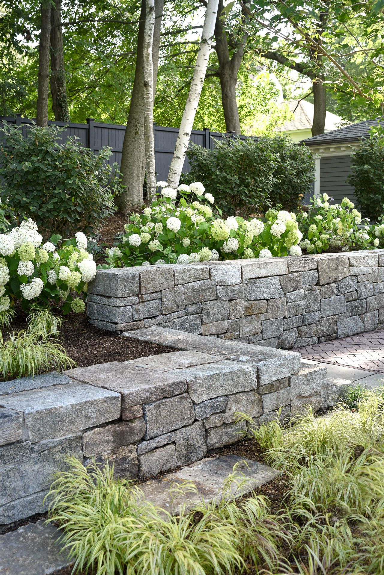 Enhance Your Outdoor Space with a
Stunning Backyard Design Retaining Wall