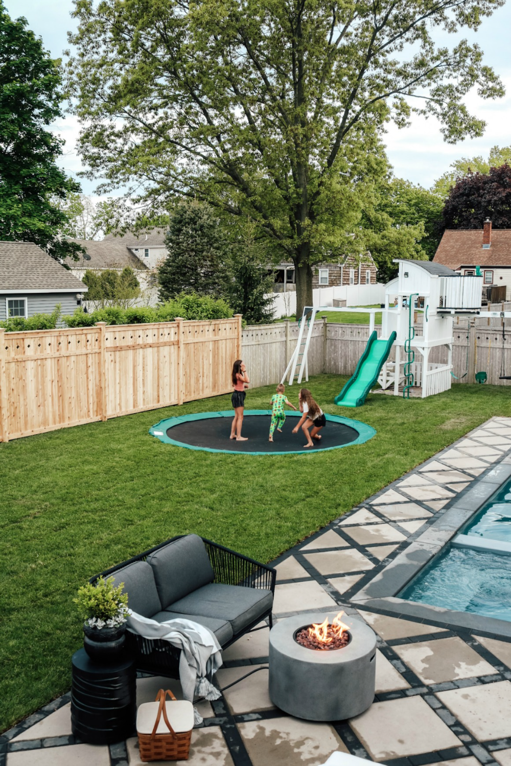 Transform Your Backyard with a  Trampoline: Tips for Stylish and Safe Design