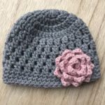 Crocheted baby hat with flower multiple sizes available by KNUFL