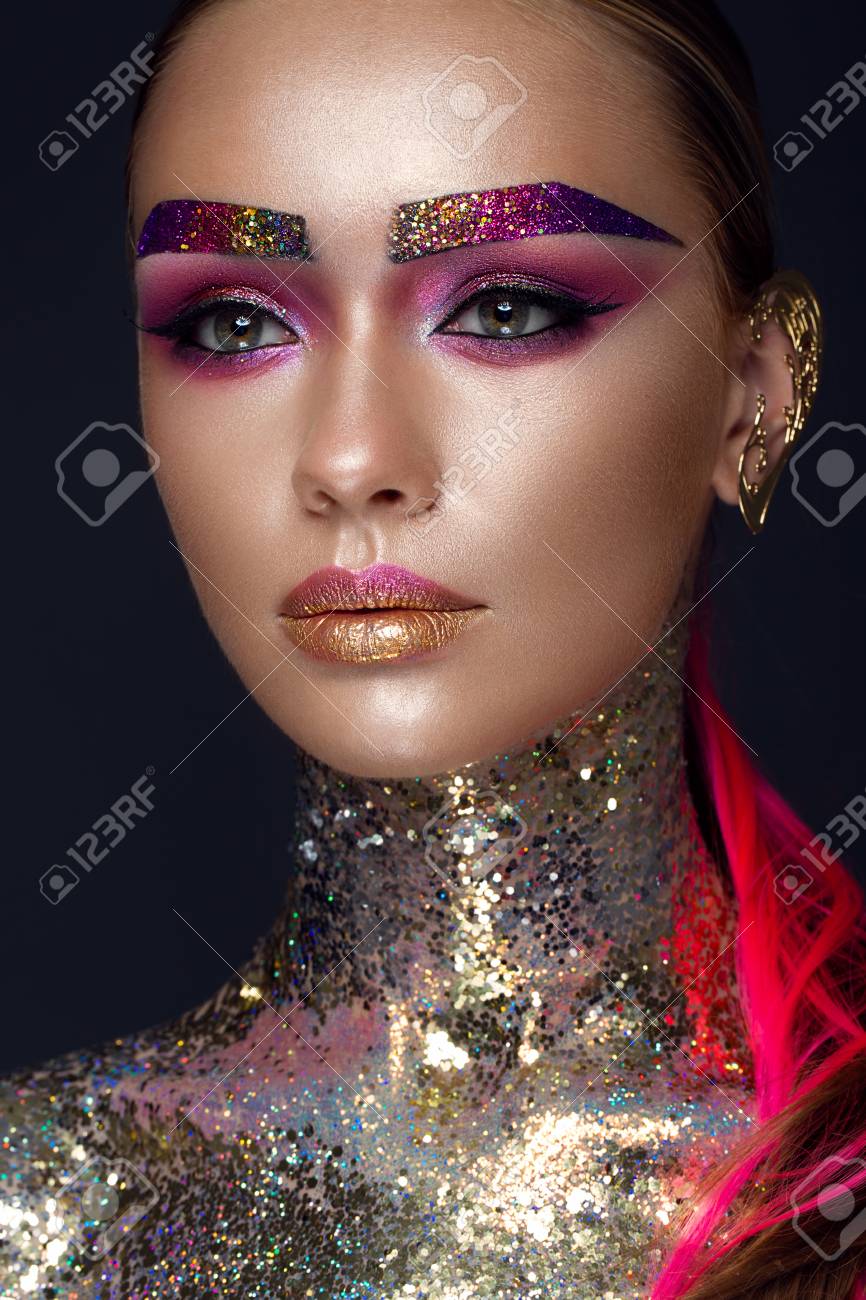 Beautiful girl with creative glitter makeup with sparkles, unusual  eyebrows. Beauty is an art