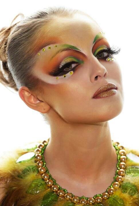 Crystal accented artistic and colorful fantasy make-up.