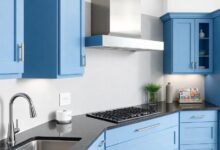 Elevating Elegance: The Allure of Blue Kitchen Cabinets with Black Granite Countertops